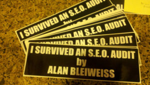 bumper stickers with the words I survived an SEO audit by Alan Bleiweiss